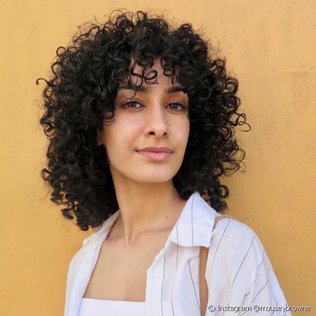 Découvrez la coupe de cheveux bouclée parfaite pour chaque type de visage !