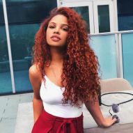 Red hair on brown skin: which colors suit skin tone